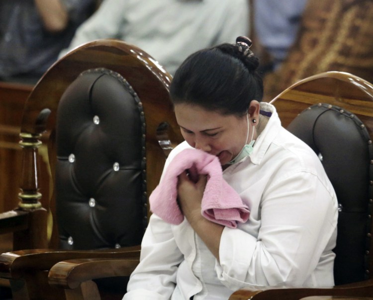 Meiliana weeps during her sentencing hearing at a district court in Medan, North Sumatra, Indonesia, on Tuesday. She got 18 months in prison.
