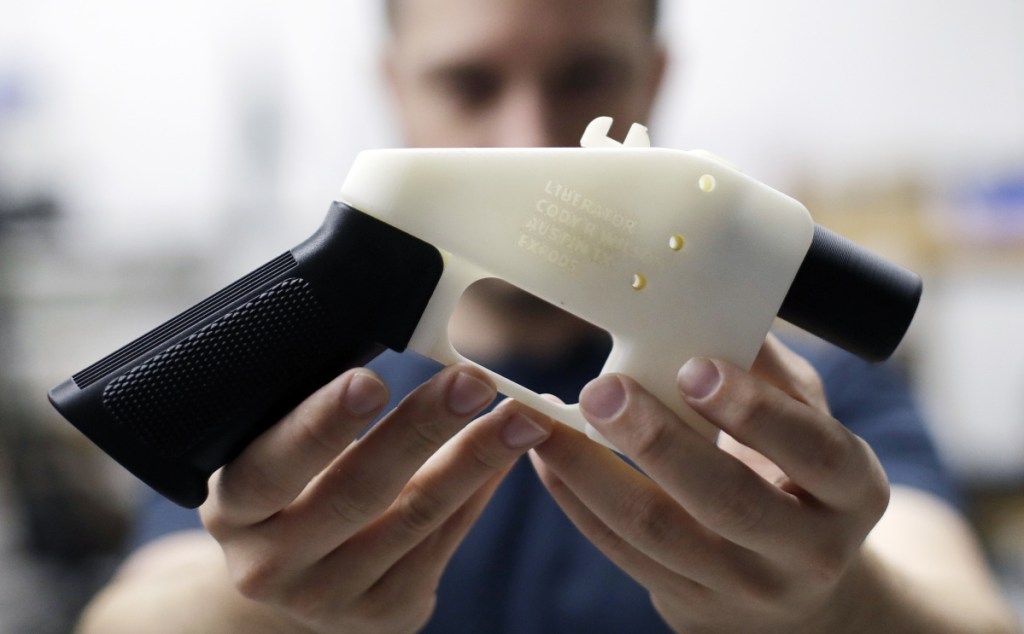 Cody Wilson of Defense Distributed holds a 3-D printed gun called the Liberator at his shop Aug. 1 in Austin, Texas. A federal judge in Seattle has granted an injunction that prohibits the Trump administration from allowing a Texas company to post 3-D gun-making plans online.