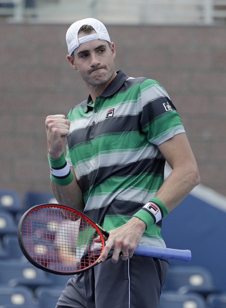John Isner of the United States, seeded No. 11, strolled into the second round by defeating countryman Bradley Klahn in straight sets in New York.