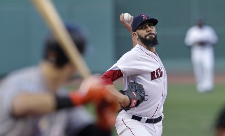 Boston starting pitcher David Price delivers during the first inning against Miami Marlins at Fenway Park on Wednesday. Price left the game after three innings with a bruised wrist.