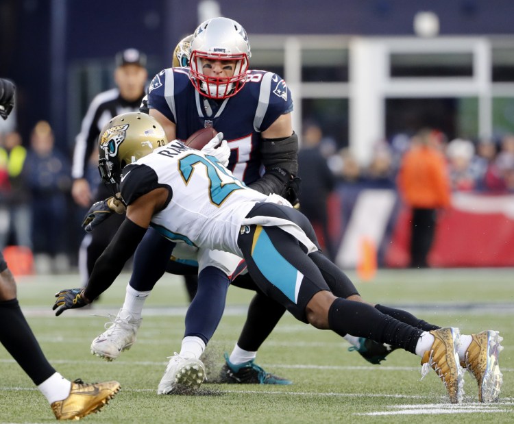 Jacksonville cornerback Jalen Ramsey dives to stop Rob Gronkowski of the New England Patriots during the AFC championship in Foxborough, Mass. in January.
