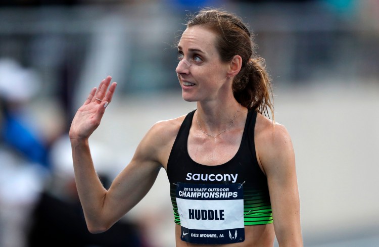 Molly Huddle waves to a fan after winning the women's 10,000 meters at the U.S. Championships athletics meet Thursday, June 21, 2018, in Des Moines, Iowa. (AP Photo/Charlie Neibergall)