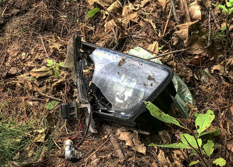A broken headlight remains on the side of the road Sunday afternoon at the scene of a fatal crash early that morning on Augusta Road in Winslow. Gabe Stuart, 52, of Waterville, was pronounced dead at the scene by medical personnel. Police have yet to determine the accident's cause.