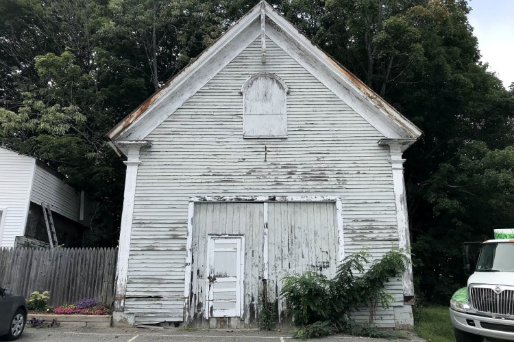 Oakland's Old School House, which dates to about 1804, is seen Friday on Church Street. The town is selling the building after the discovery of lead paint and asbestos.