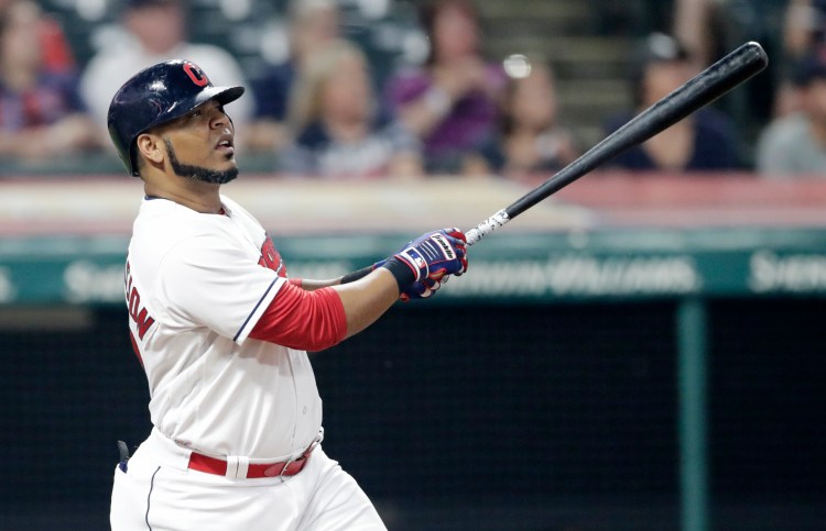 Cleveland's Edwin Encarnacion follows through on a three-run home run during the Indians' 10-0 win over teh Twins on Monday in Cleveland.