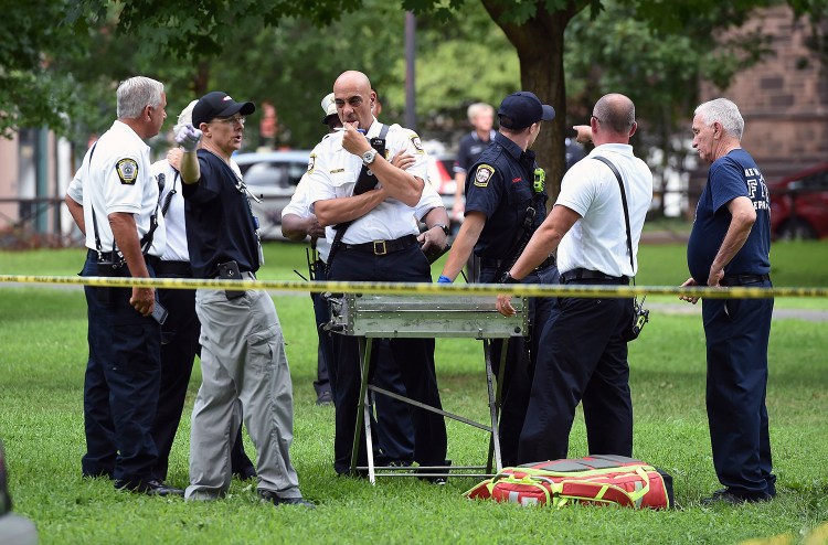 New Haven emergency personnel respond to overdose cases on the New Haven Green in Connecticut on Wednesday. Over the course of 24 hours in New Haven on Wednesday, more than 70 people overdosed on what authorities believe to be synthetic marijuana, also known as K2 or spice. No deaths were reported.