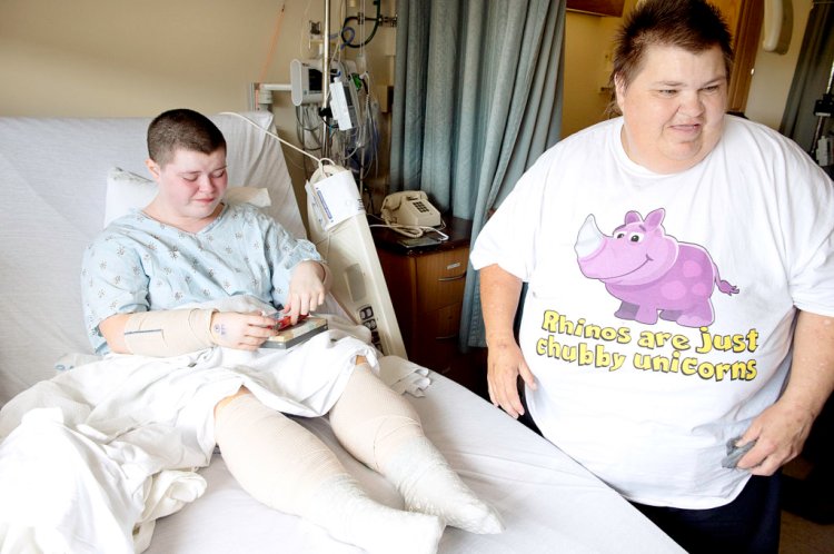 Alicia Mitchell of Rumford, right, stands next to her daughter Vicki, 17, at Central Maine Medical Center in Lewiston on Thursday. Alicia was bitten on her leg by a pit bull when she tried to intervene as the dog attacked Vicki and Vicki's sister Ashley, 18, in Rumford on Wednesday.