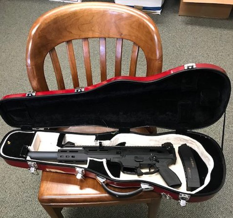Police say they seized this gun, stored in a violin case, from a man charged with terrorizing in Bowdoinham.