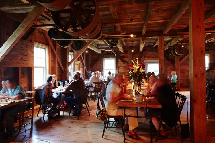 Communal tables enhance the convivial, dinner-party atmosphere of The Lost Kitchen restaurant in Freedom.