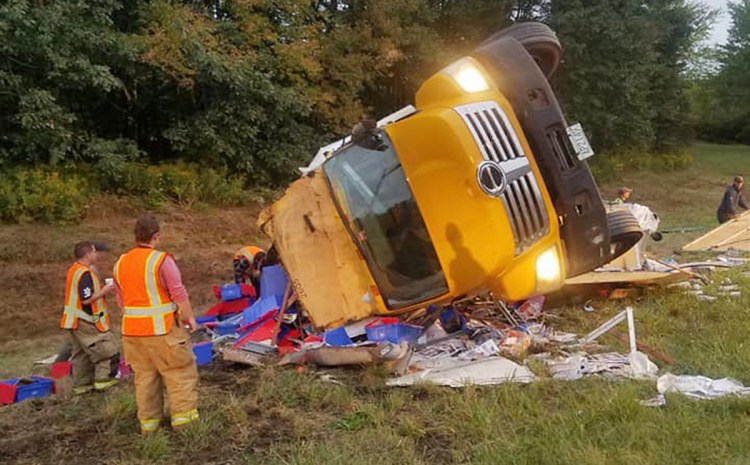 A driver suffered minor injuries after a truck carrying thousands of magazines crashed Thursday morning on the side of Interstate 295 in Richmond.