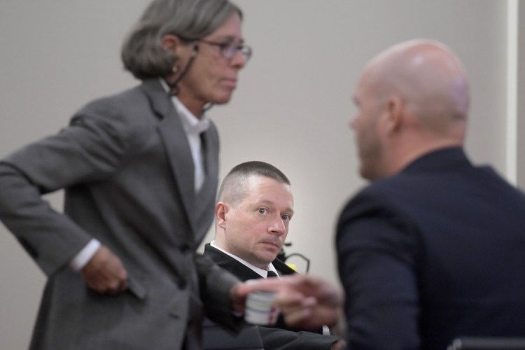 Scott Bubar, center, watches his attorneys, Lisa Whittier and Scott Hess, prepare for opening remarks Sept. 10 at Bubar's trial in Augusta. Bubar is standing trial for aggravated attempted murder of a sheriff's deputy during a shootout on May 19, 2017, in Belgrade.