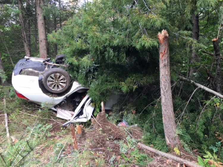 A white Honda Accord driven by Leslie Ridley Jr., of Skowhegan, crashed off Thurston Hill Road in Madison injuring three people, including Ridley, police said, on Saturday, Sept. 22, 2018.