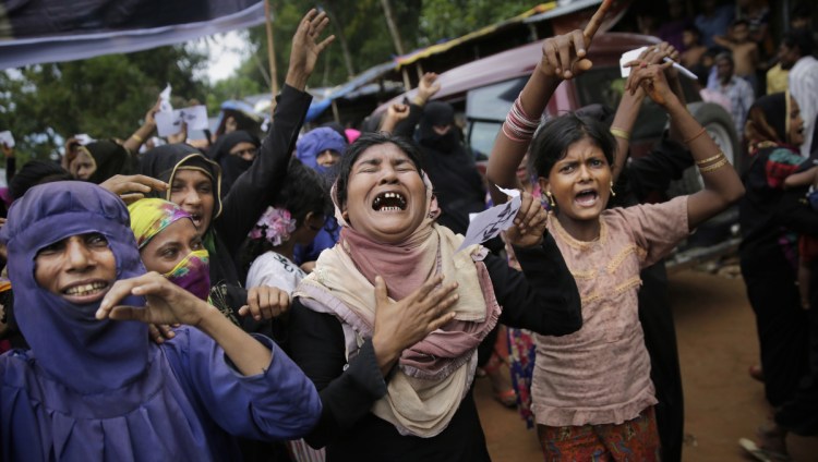 Rohingya women cry during an Aug. 25 rally at a Bangladesh refugee camp, marking the first anniversary of the Myanmar army's crackdown. The U.N. estimates the toll at a "conservative" figure of 10,000 killed.