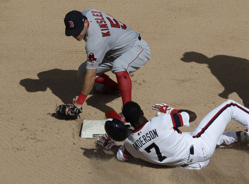Chicago White Sox's Tim Anderson (7) slides safely into second base after hitting a double as Boston Red Sox second baseman Ian Kinsler applies a late tag during the sixth inning of a baseball game Sunday, Sept. 2, 2018, in Chicago. (AP Photo/Nam Y. Huh)
