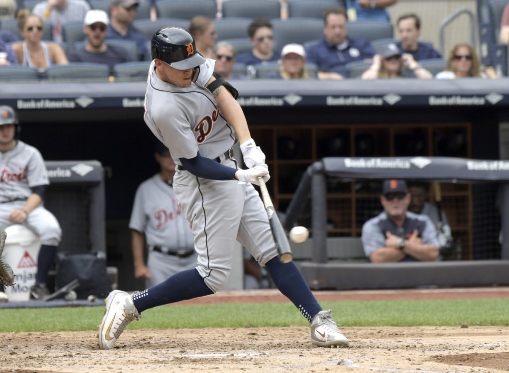 The Tigers' JaCoby Jones hits a two-run double during the fourth inning of Detroit's 11-7 victory over the Yankees in New York on Sunday.
