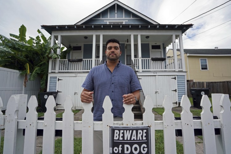 Alex Ramirez stands in front of a short-term rental property that he refurbished from a blighted state in Mid City New Orleans. Officials are looking at the benefits and headaches of the vacation rental industry.