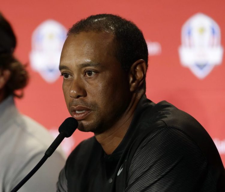 Tiger Woods, right, and Phil Mickelson were added to the U.S. Ryder Cup team on Wednesday by captain Jim Furyk. Bryson DeChambeau, who has won the first two FedEx Cup playoff events, was also added to the team.