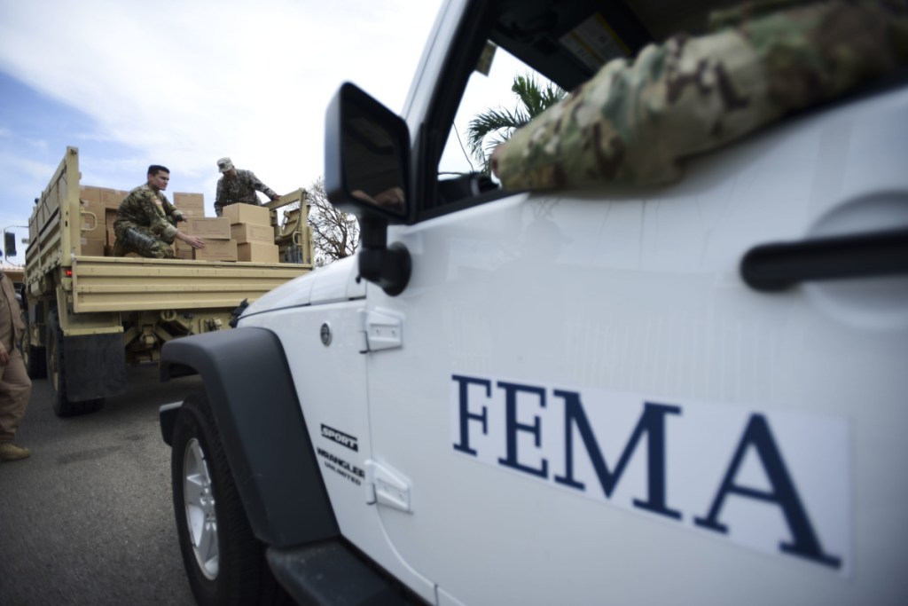 Department of Homeland Security personnel distribute supplies in Puerto Rico in October 2017. A report by the Government Accountability Office says that FEMA personnel were not prepared to deal with the aftermath of Hurricane Maria.