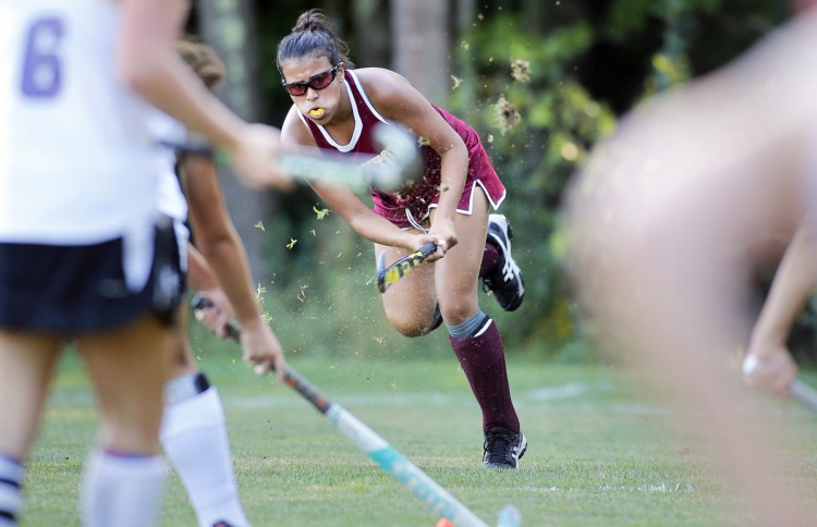 Thornton Academy's Aliyah Bureau sends the ball forward during a Class A South field hockey match Wednesday against Marshwood. Bureau assisted on the first goal for the Trojans in a 2-0 victory.