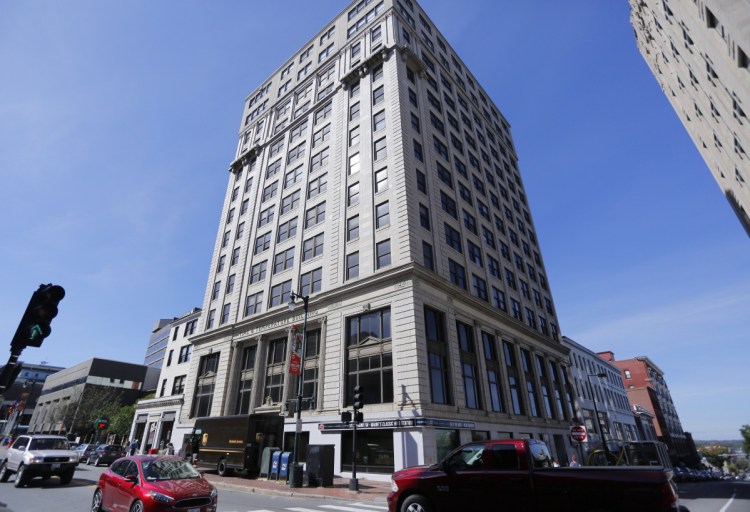 The 14-story Time & Temperature Building at 477 Congress St. – which opened in 1924 as the 12-story Chapman Building – was seized by a collections agency in 2016 after years of neglect and a mass exodus of tenants. 