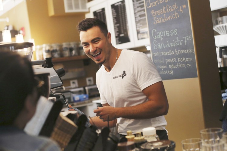 Albanian immigrant Mateo Hodo makes lattes at his Portland coffee shop, Coffee Me Up. A letter writer points out the contributions that immigrants make to Portland.