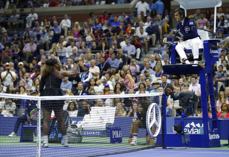 Serena Williams argues with chair umpire Carlos Ramos during a match against Naomi Osaka in the women's final of the U.S. Open on Saturday in New York. Williams lost the match 6-2, 6-4.