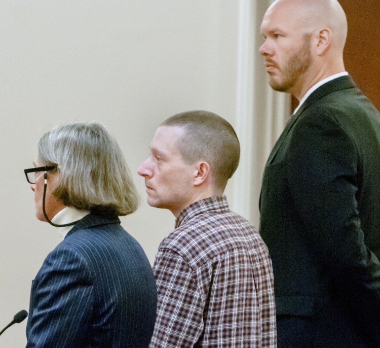 Scott A. Bubar, center, is flanked by attorneys Lisa Whittier and Scott Hess during his bail hearing Nov. 1, 2017, at the Capital Judicial Center in Augusta. 