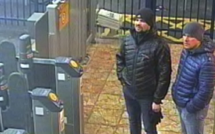 Image issued by London police Wednesday shows Russlans Ruslan Boshirov and Alexander Petrov at the Salisbury train station on March 3. British prosecutors have charged them with the nerve agent poisoning of ex-spy Sergei Skripal.