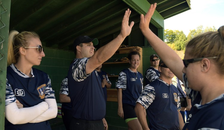The Waterville Police Department softball team celebrates a run Sunday during the Fraternal Order of Police tournament in Sidney. The fourth annual tournament was held in honor of Cole's father, Somerset Deputy Cpl. Eugene Cole, who lost his life in the line of duty April 25 in Norridgewock.