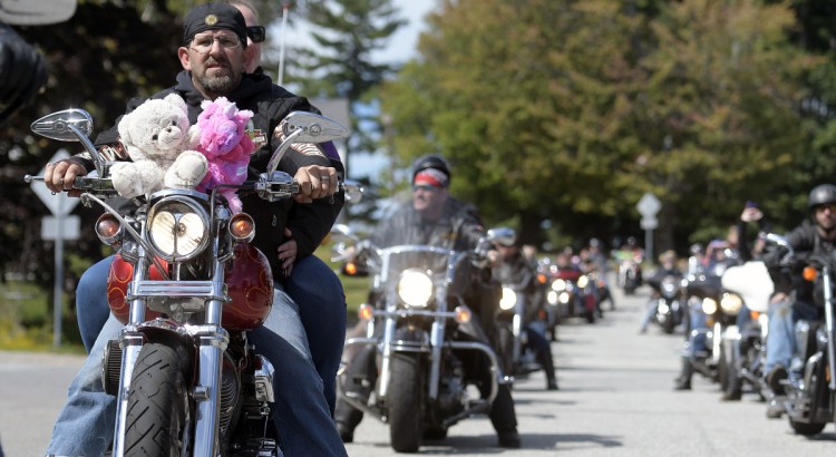 Motorcyclists ride through Augusta on Sunday on the annual United Bikers of Maine Toy Run.