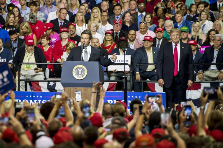 Rep. Ron DeSantis, R-Fla., is joined by President Trump at a campaign rally in Tampa, Fla., on July 31. DeSantis later won Florida's Republican primary for governor.