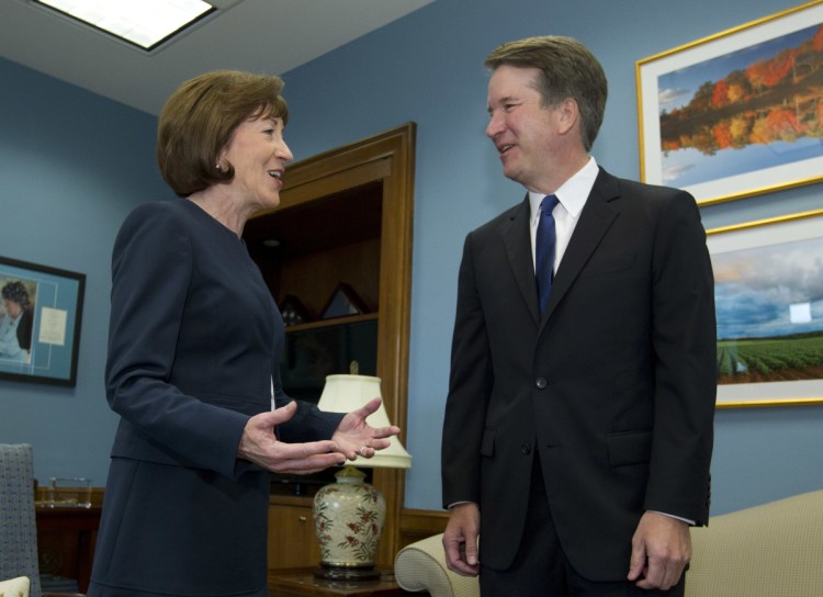 Sen. Susan Collins speaks with U.S. Supreme Court nominee Brett Kavanaugh before their private discussion Aug. 21 at her office on Capitol Hill.