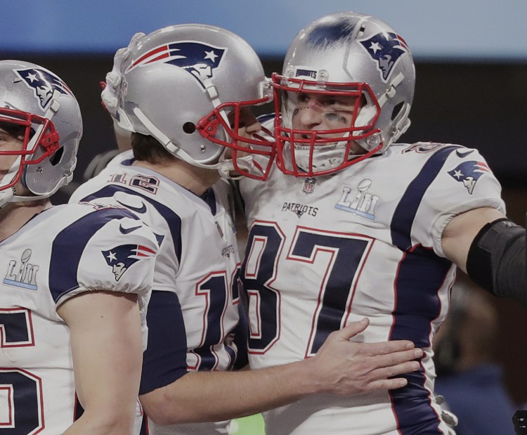 Quarterback Tom Brady, left, has done marvelous things with so many receivers over the years. But there's nothing like his partnership with tight end Rob Gronkowski, right. Nothing.
