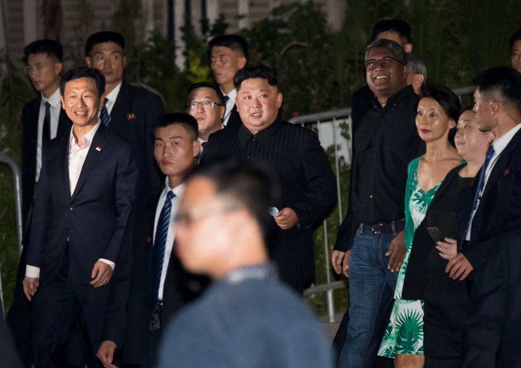 North Korean leader Kim Jong Un, center, tours the Esplanade in Singapore on June 11. Talks have begun for a follow-up meeting between Kim and President Trump.