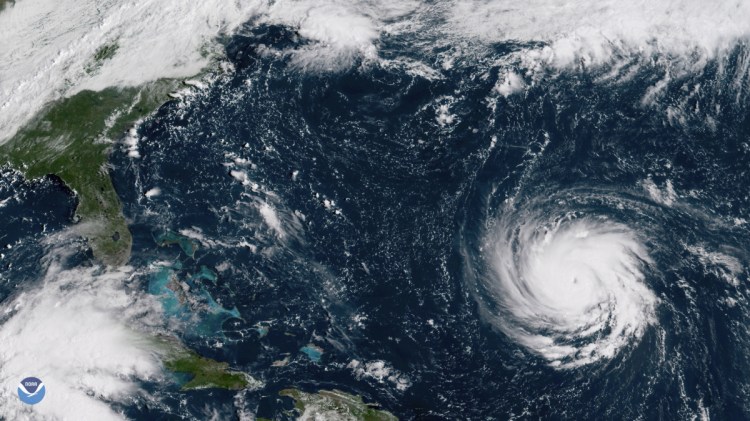 This satellite image provided by NOAA shows Hurricane Florence as it threatens the U.S. East Coast. As mandatory evacuations begin for parts of several East Coast states, millions of Americans have been preparing for what could become one of the most catastrophic hurricanes to hit the Eastern Seaboard in decades.