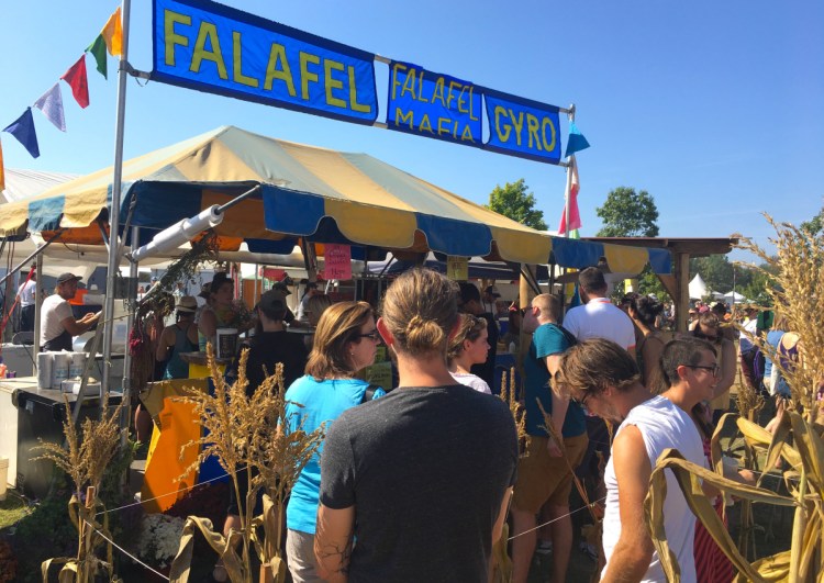 Falafel Mafia attracts a line at midday at the Unity fair. The longtime Common Ground Fair vendor is now known for its all-vegan food truck that sets up in and around Portland.