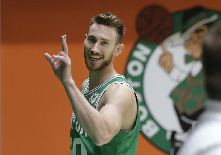 Boston's Gordon Hayward waves as he steps off the basketball court after speaking with members of the media and taking part in a photo shoot on Thursday. Hayward is working his way back from a broken leg.