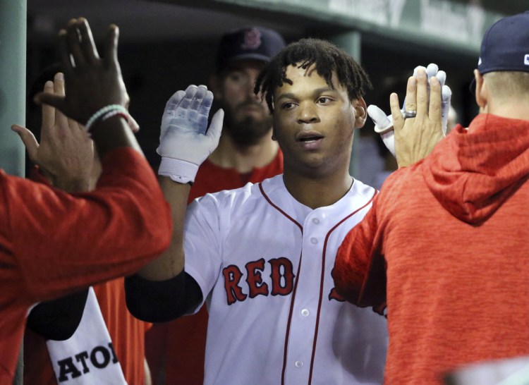 Boston's Rafael Devers celebrates his solo home run in the sixth inning Thursday night against the Toronto Blue Jays at Fenway Park. The Red Sox won, 4-3.