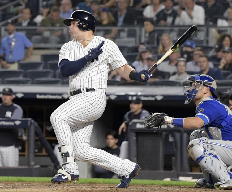 New York's Luke Voit hits a two-run double in the first inning Friday night when the Yankees scored five runs on the way to an 11-0 win over the Blue Jays in New York.