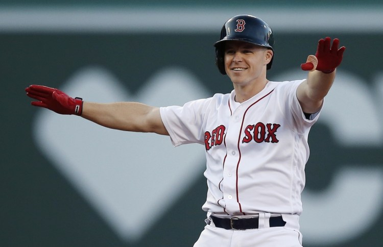 Boston's Brock Holt reacts to his two-run double during the fifth inning of Saturday's game against the New York Mets in Boston.