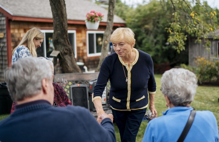 Democratic candidate for governor Janet Mills, the state's attorney general, greets supporters at the South Portland home of State Rep. Lois Reckitt on Sept. 8. Described by her brother Peter as "an incredible fighter," she defeated six opponents to win her party's nomination in June.