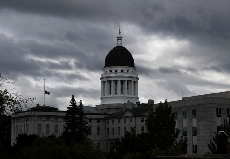 Associated Press/Robert F. Bukaty
The Maine State House is seen last month in Augusta. Term limits and voter reaction to two non-candidates in the upcoming elections – President Trump and Gov. LePage – could play an outsized role in 2018's State House races.