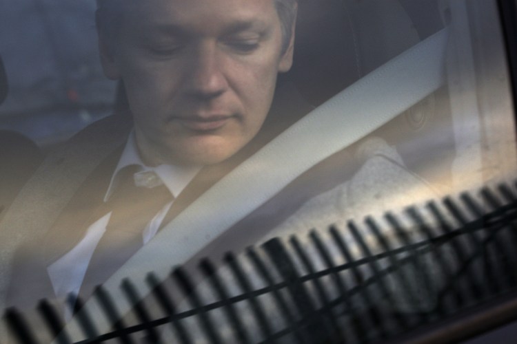 WikiLeaks founder Julian Assange arrives at Belmarsh Magistrate's court in London for an extradition hearing in 2011. According to a cache of internal WikiLeaks files obtained by the AP, Assange sought a Russian visa and staffers at his radical transparency group discussed having him skip bail and escape Britain as authorities closed in on him in late 2010.