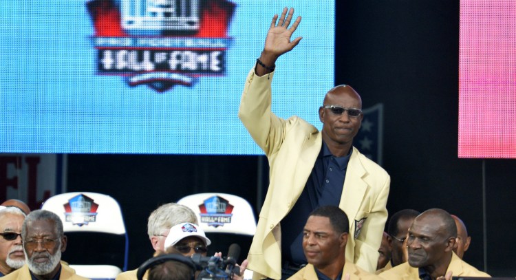 Former running back Eric Dickerson, during his Pro Football Hall of Fame enshrinement Aug. 2, 2014, is among a group of Hall of Famers demanding health insurance coverage and a share of NFL revenues.