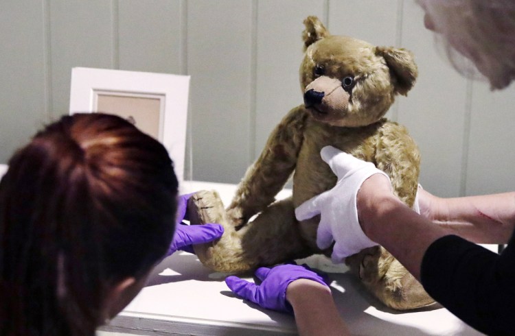 An antique bear is positioned for a show that will open Saturday at the Museum of Fine Arts in Boston.