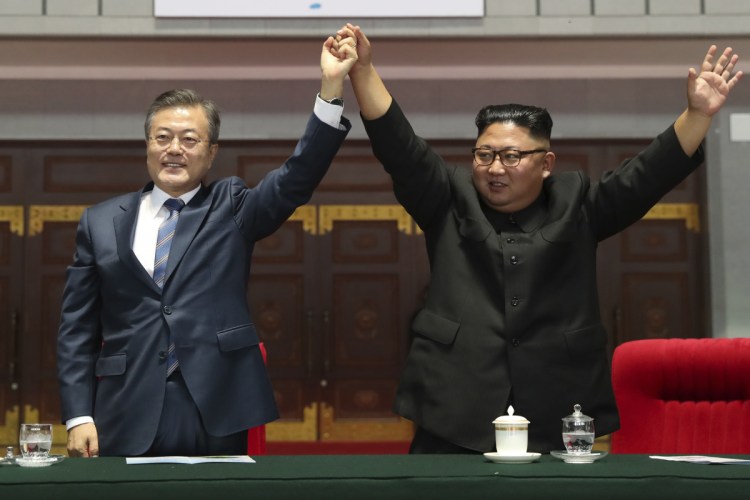 South Korean President Moon Jae-in and North Korean leader Kim Jong Un greet to Pyongyang citizens in Pyongyang, North Korea on Wednesday.