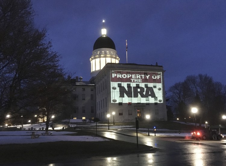In March, LumenARRT! – part of the Artists Rapid Response Team – projected protest messages on the State House. The Legislative Council voted 6-0 Thursday to prohibit such political displays.