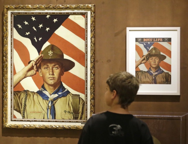 Andrew Garrison, 11, of Salt Lake City looks over the Rockwell exhibition at the Mormon Church History Museum in Salt Lake City.