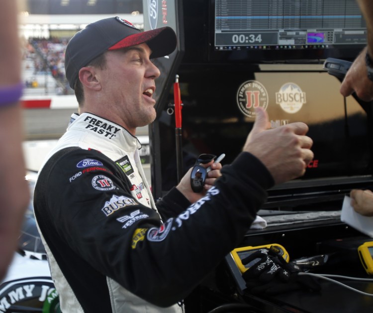 Kevin Harvick gives his crew a thumbs-up Friday night after qualifying on the pole for the NASCAR Cup Series race Saturday night at Richmond Raceway in Virginia.