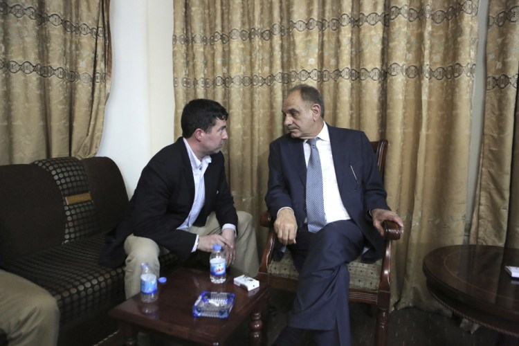 Sam Patten, left, speaks with Iraqi Deputy Prime Minister Saleh Mutlaq in Baghdad in April 2014. As Patten advised him in his bid to become prime minister that year, the Maine native had to protect himself with armored glass and security guards. Patten, 47, pleaded guilty last month to failing to register as a foreign agent related to his lobbying work in Ukraine. He also coordinated with a Russian national to help a Ukrainian citizen donate $50,000 to President Trump's inaugural committee. 